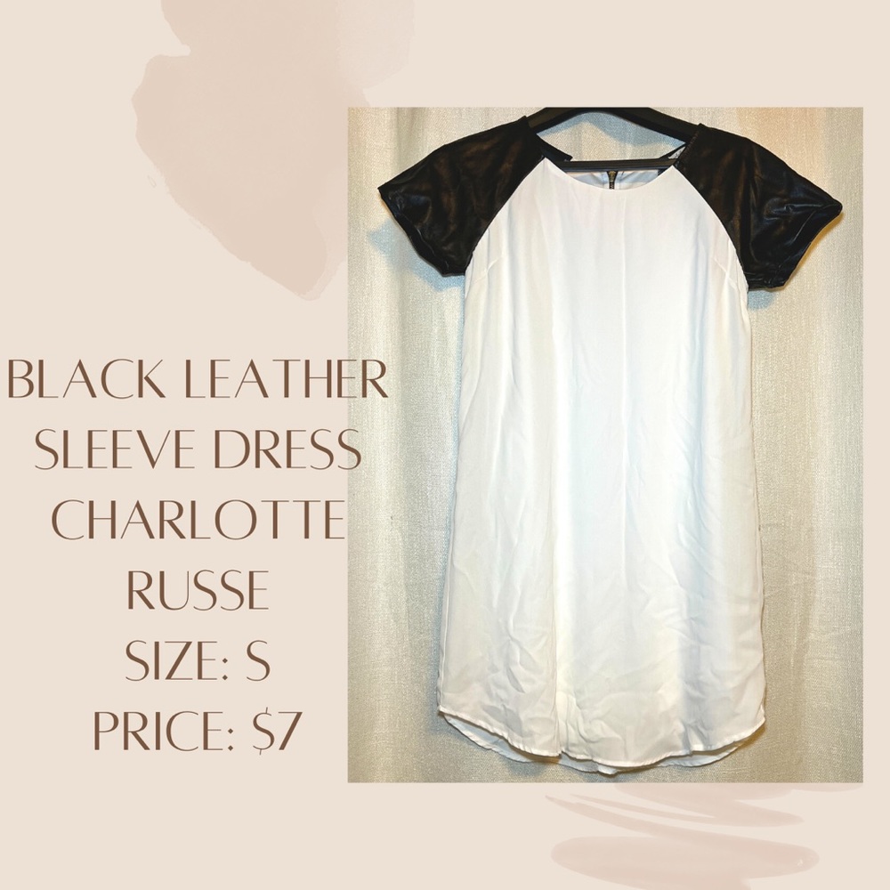 White dress with black leather sleeves.